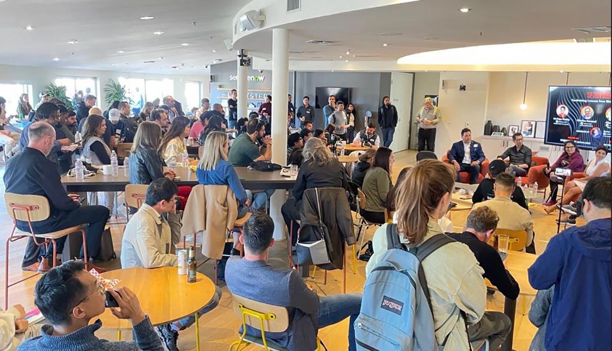 Image of attendees listening to a round table conference at San Francisco Techweek.